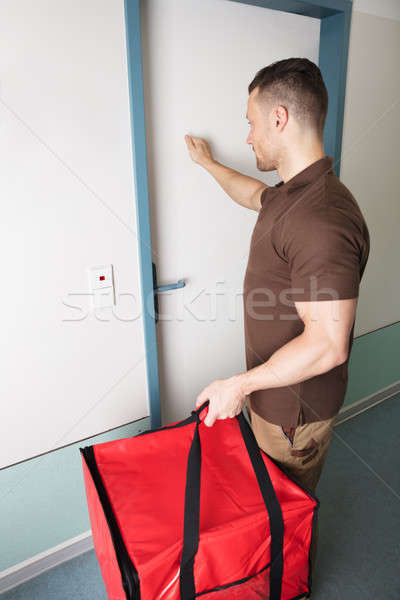 Pizza Delivery Man Knocking The Door Stock photo © AndreyPopov