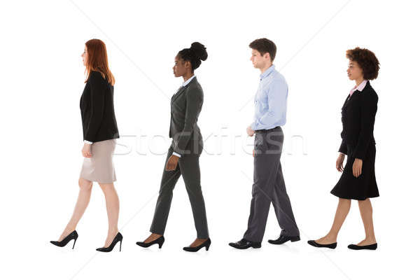 Multiracial Businesspeople Walking In Row Stock photo © AndreyPopov