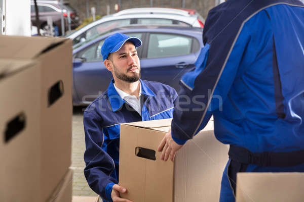 Mover Holding Cardboard Box Stock photo © AndreyPopov