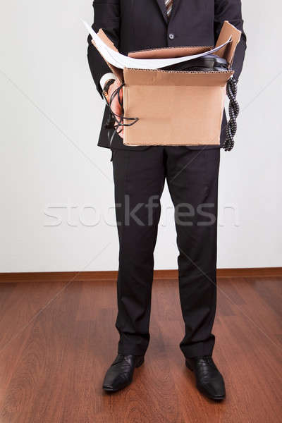 Downsized employee with belongings Stock photo © AndreyPopov