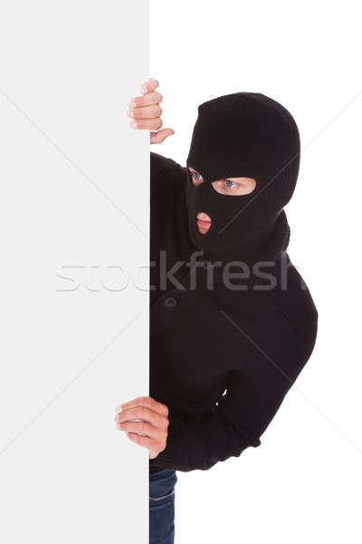 Einbrecher halten Plakat isoliert weiß Hand Stock foto © AndreyPopov