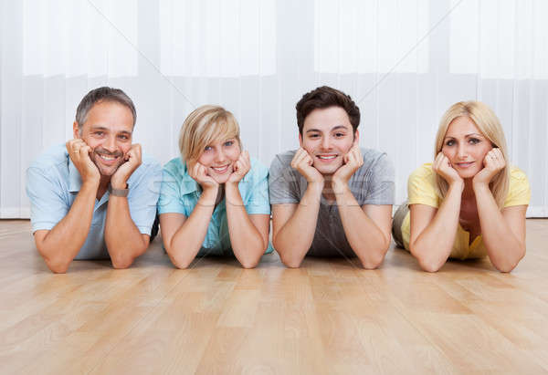 Joyful family with heads together Stock photo © AndreyPopov