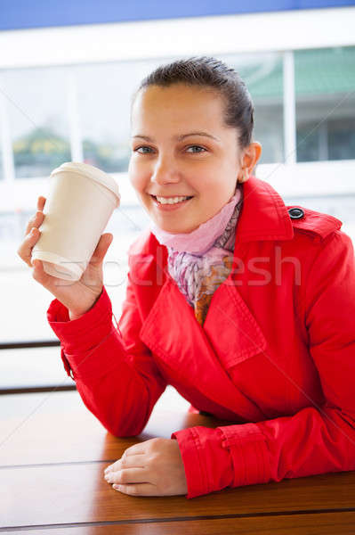 Jeunes heureux femme jetable tasse [[stock_photo]] © AndreyPopov