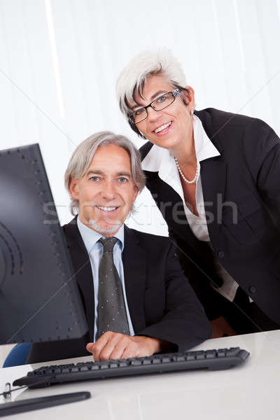 Senior partners at a business meeting Stock photo © AndreyPopov