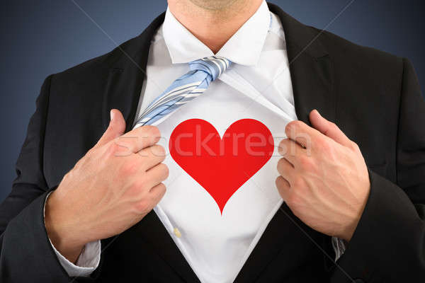 Businessman Pulling His Shirt Showing Heart Shape Symbol Stock photo © AndreyPopov