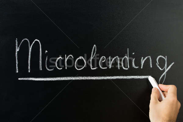 Hand Writing Microlending Text On Blackboard Stock photo © AndreyPopov