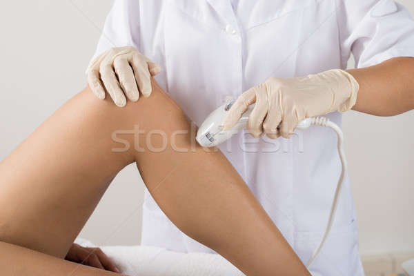 Woman Receiving Laser Treatment At Beauty Clinic Stock photo © AndreyPopov