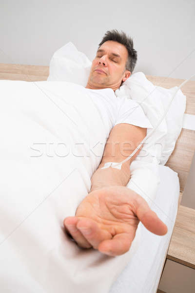 Patient Resting On Bed With Iv Drip Stock photo © AndreyPopov