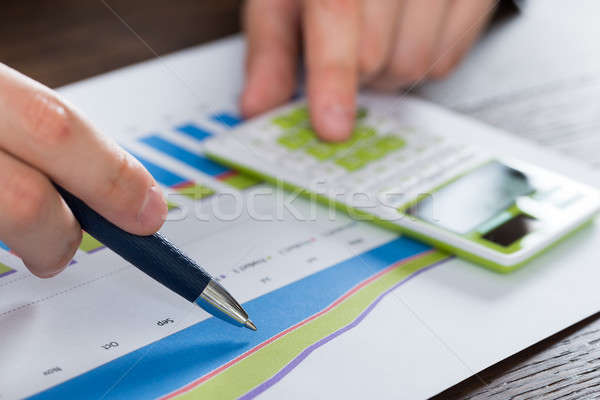 Személy kezek pénzügyi beszámoló közelkép számológép iroda Stock fotó © AndreyPopov