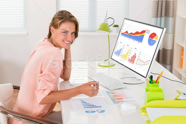 Woman Analyzing Financial Graphs Stock photo © AndreyPopov