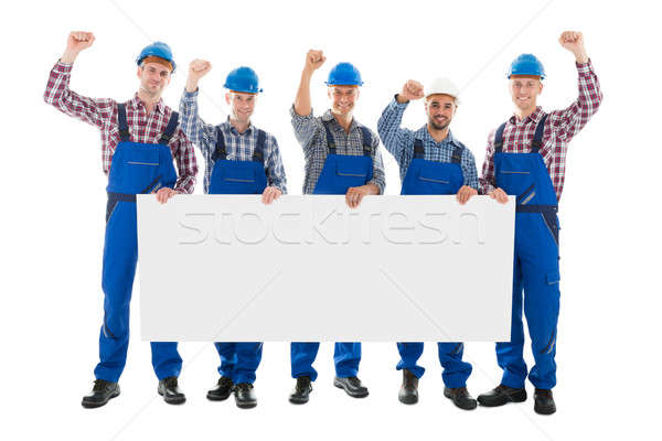 Male Carpenters With Arms Raised Holding Blank Billboard Stock photo © AndreyPopov