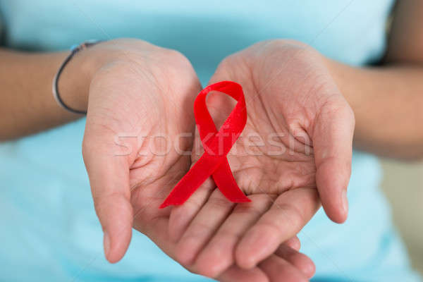 Woman Holding Aids Awareness Ribbon Stock photo © AndreyPopov