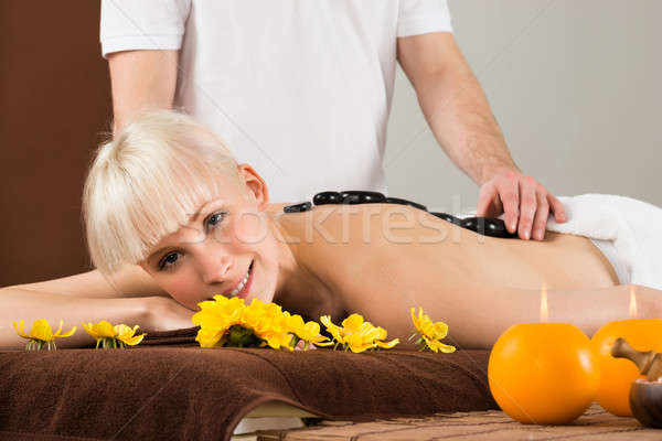 Stockfoto: Jonge · vrouw · hot · steen · therapie · bloem