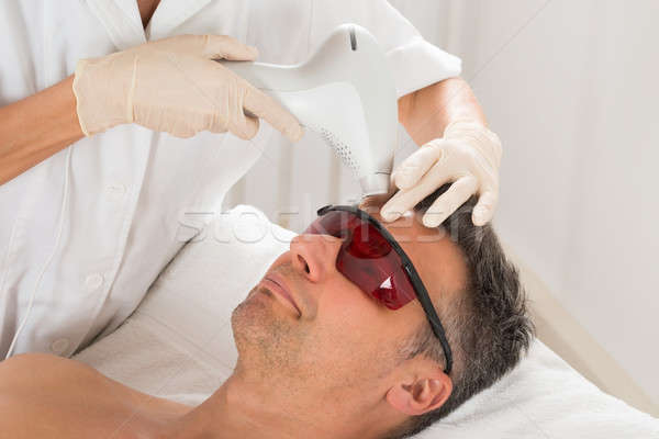 Man Receiving Laser Epilation Treatment Stock photo © AndreyPopov