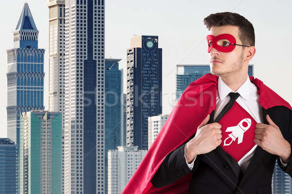 Businessman Opening Coat In Superhero Style Stock photo © AndreyPopov