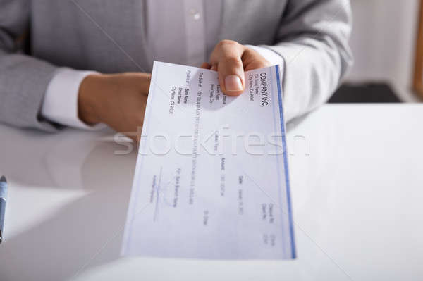 Businessperson Giving Cheque In Office Stock photo © AndreyPopov