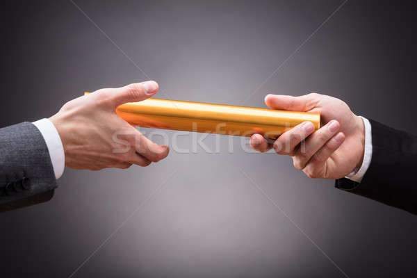 Person Passing Baton To Businessperson Stock photo © AndreyPopov