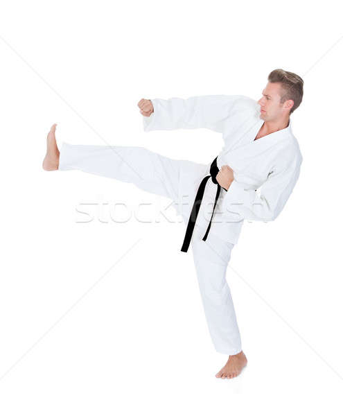 Young Man Practicing Karate Stock photo © AndreyPopov