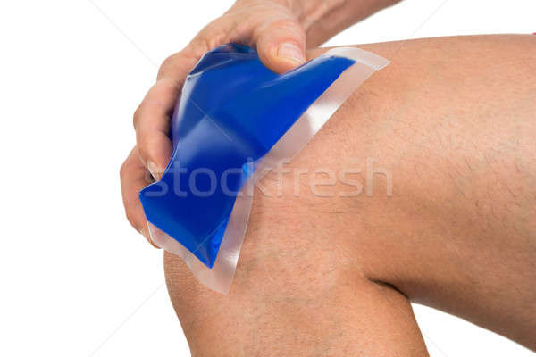 Hand Holding Ice Gel Pack On Knee Stock photo © AndreyPopov