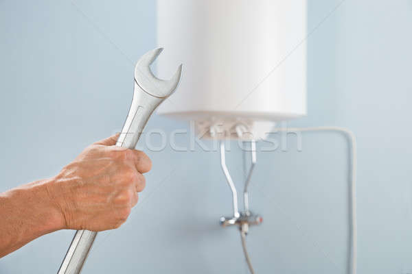 Person Holding Spanner Stock photo © AndreyPopov