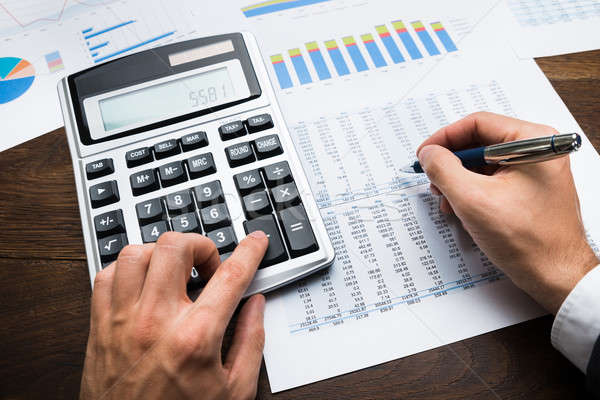 Businessman Doing Financial Calculations Stock photo © AndreyPopov