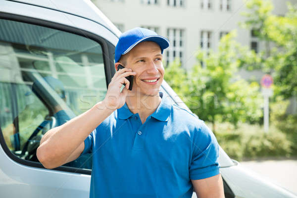 Worker In Front Truck Talking On Mobile Phone Stock photo © AndreyPopov