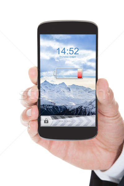 [[stock_photo]]: Main · téléphone · portable · faible · batterie · personne