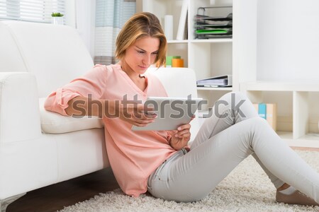 Stock photo: Woman Suffering From Stomach Ache While Sitting On Sofa