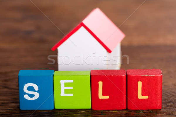 Ház modell mögött szó elad színes Stock fotó © AndreyPopov