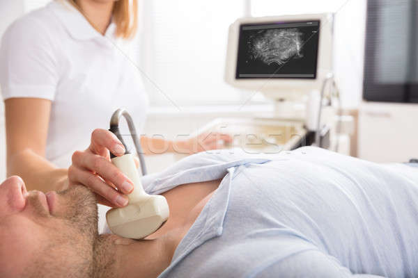 Male Patient Undergoing Ultrasound Of Thyroid Stock photo © AndreyPopov