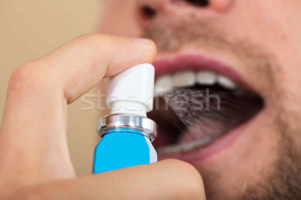 Uomo respiro primo piano mano denti stampa Foto d'archivio © AndreyPopov