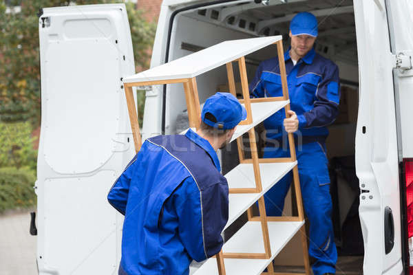 Two Delivery Men Unloading Shelf From Truck Stock photo © AndreyPopov