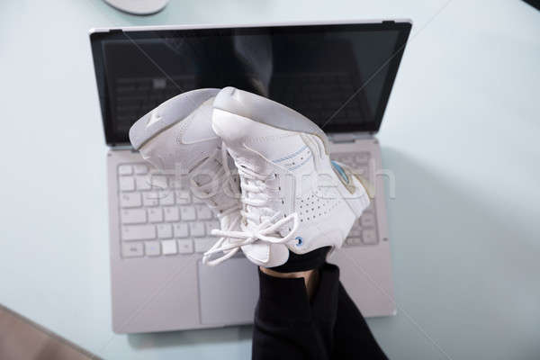 Stock photo: Businesswoman's Crossed Leg On Laptop