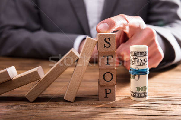 Rolled Up Banknotes Near Stop Blocks Stock photo © AndreyPopov