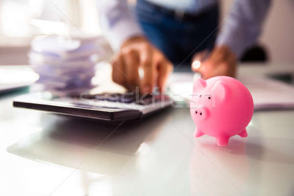 Close-up Of Pink Piggybank On Desk Stock photo © AndreyPopov