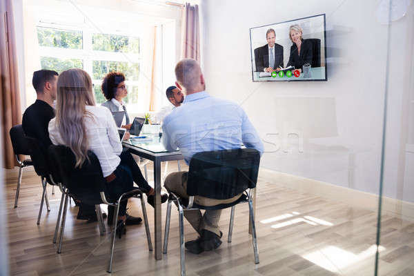 Grupo diverso vídeo sala de reuniões olhando Foto stock © AndreyPopov