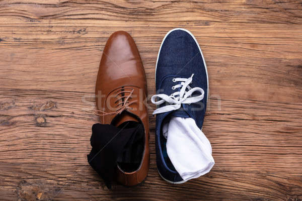 Elevated View Of Male's Formal And Sport Shoe Stock photo © AndreyPopov