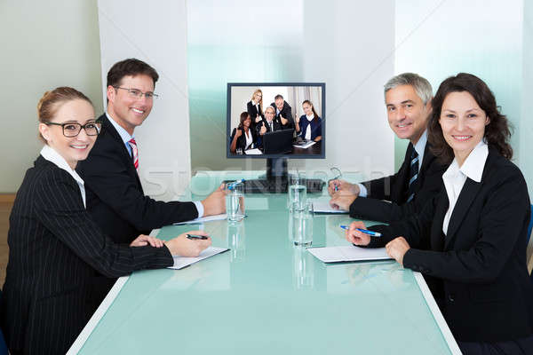 Businesspeople watching an online presentation Stock photo © AndreyPopov