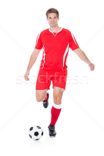 Soccer Player Kicking Football Stock photo © AndreyPopov
