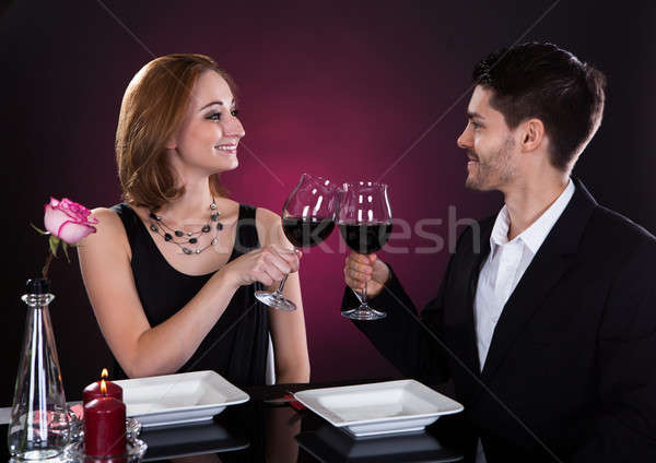 Happy couple in restaurant Stock photo © AndreyPopov