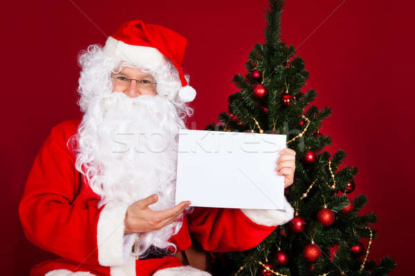 Stock photo: Portrait of a santa holding blank placard