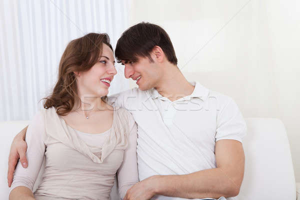Affectionate couple relaxing on a sofa  Stock photo © AndreyPopov