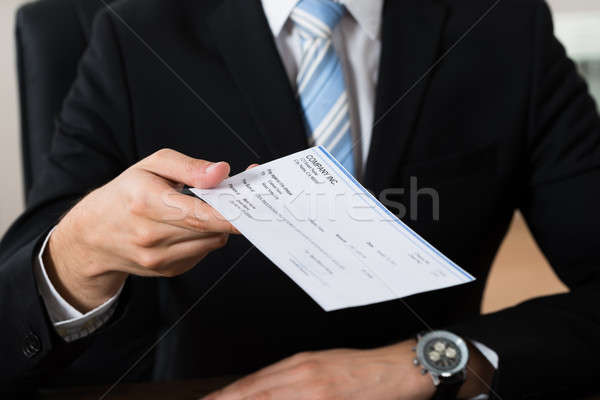 Businessman Giving Cheque Stock photo © AndreyPopov