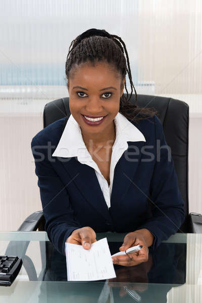 Femme d'affaires offrant chèque portrait jeunes femme [[stock_photo]] © AndreyPopov