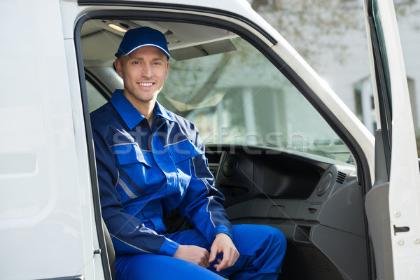 Portrait Of Happy Technician Sitting In Van Stock photo © AndreyPopov