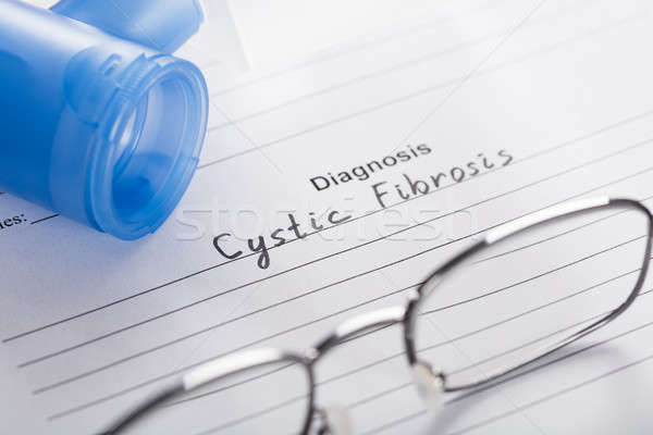 Inhaler Mask And Glasses With Text Diagnosis Cystic Fibrosis Stock photo © AndreyPopov