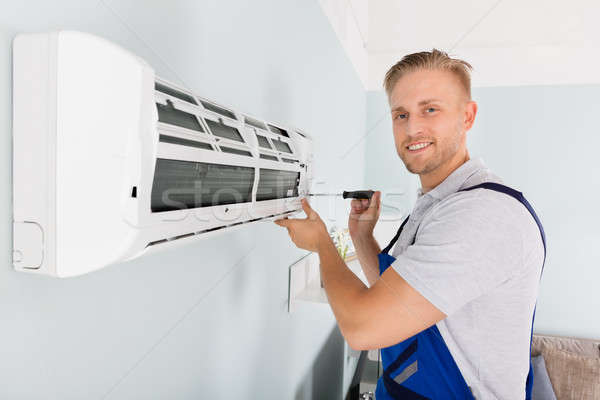 Technician Fixing Air Conditioner Stock photo © AndreyPopov