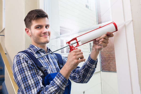 Worker Applying Glue With Silicone Gun Stock photo © AndreyPopov