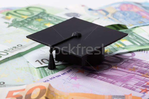 Graduation Cap On Euro Banknotes Stock photo © AndreyPopov