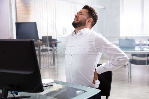 Businessman Suffering From Back Pain Stock photo © AndreyPopov